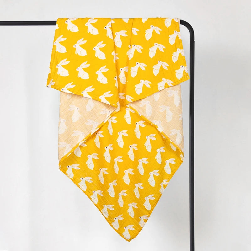 Large cotton muslin baby wrap in yellow and cream print