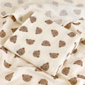 Two-layer cotton muslin baby bath blanket in cream with small print