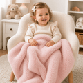 Two faux fur baby blankets